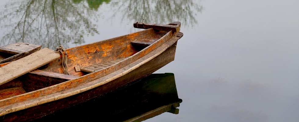 Wooden canoe in water