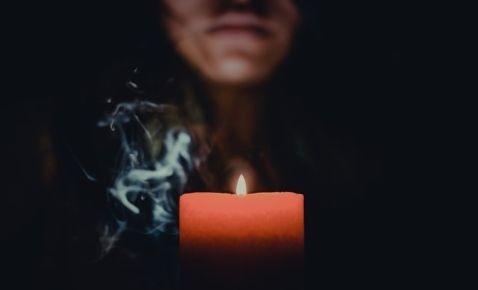 Smoky lit candle